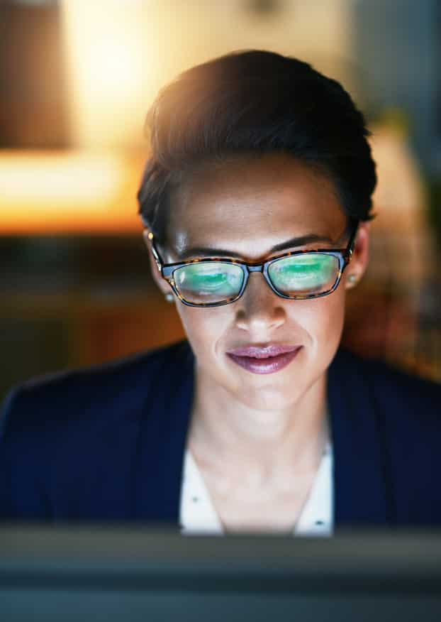 Alignment - Somewhat relieved and contented woman reviewing information online